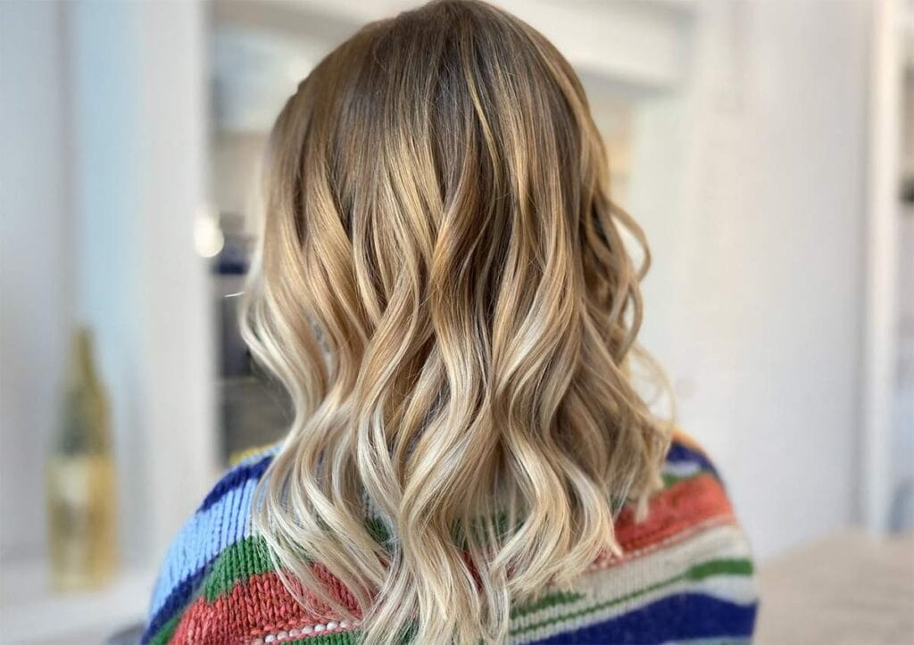 Blonde highlights NYC wavy hair Color And Andy Bowery salon - hair color trends NYC 2026